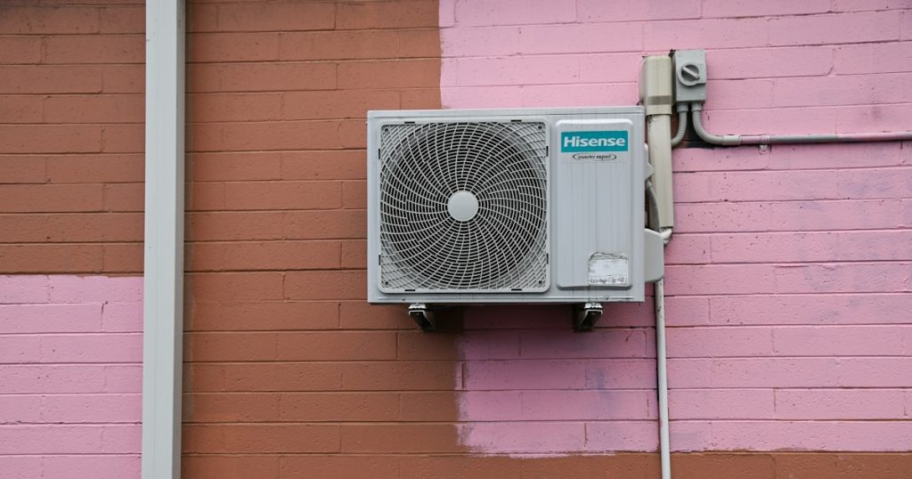 A air conditioner mounted to the side of a building