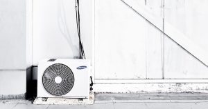 grayscale photography of outdoor AC unit