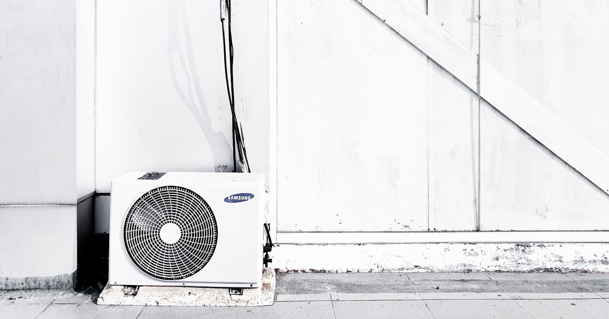 grayscale photography of outdoor AC unit