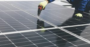 a person working on a solar panel