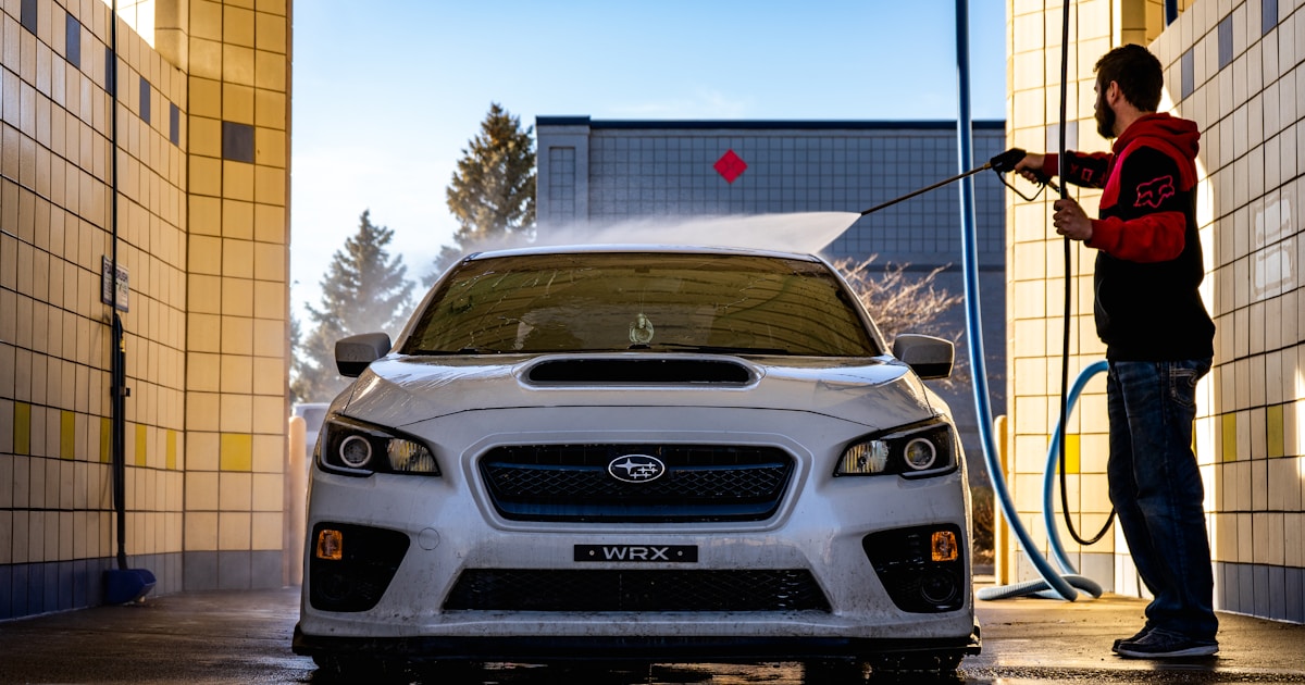 white chevrolet car parked on gray concrete road during daytime