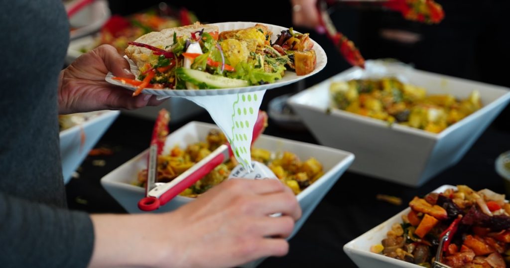 person holding white ceramic bowl with food