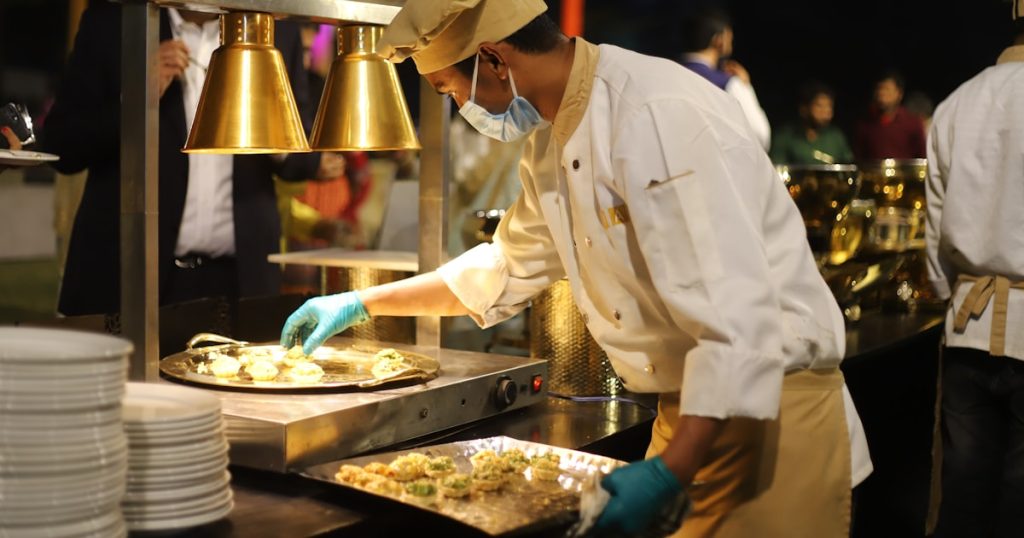 man in white chef uniform cooking
