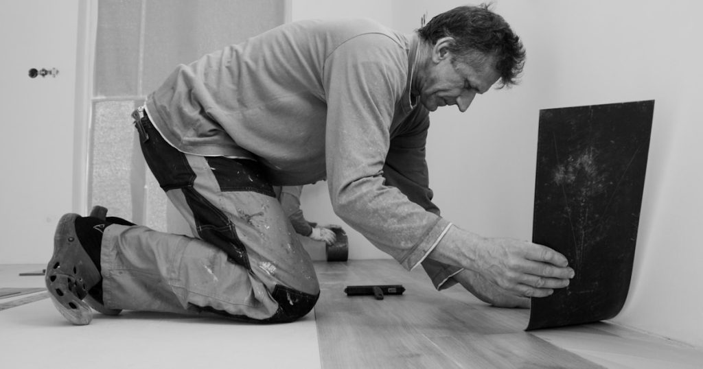 A man laying on the floor in a room