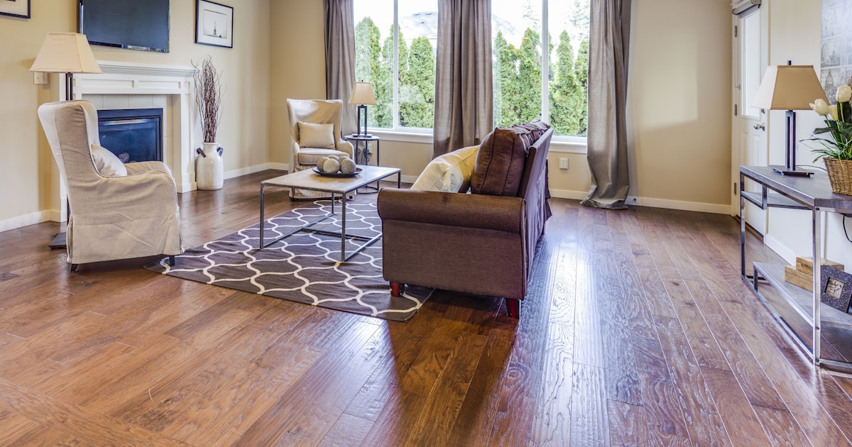 a living room filled with furniture and a fire place