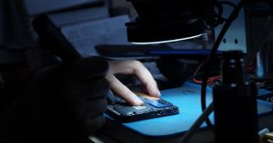 A person using a mouse on a mouse pad