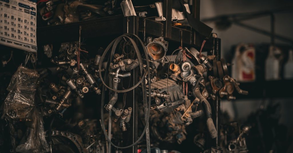 a bunch of engine parts sitting on top of a shelf