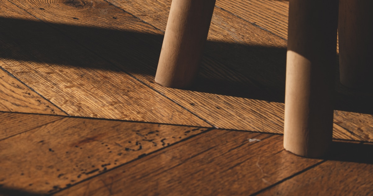 black round seat on brown wooden floor