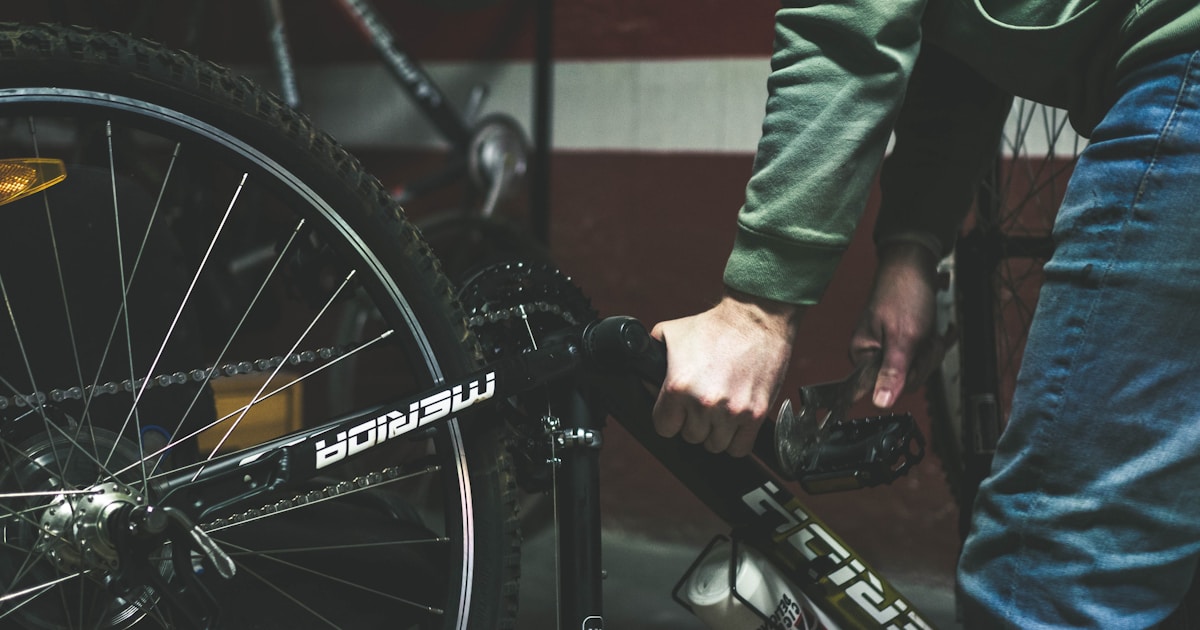 a close up of a person holding a bike