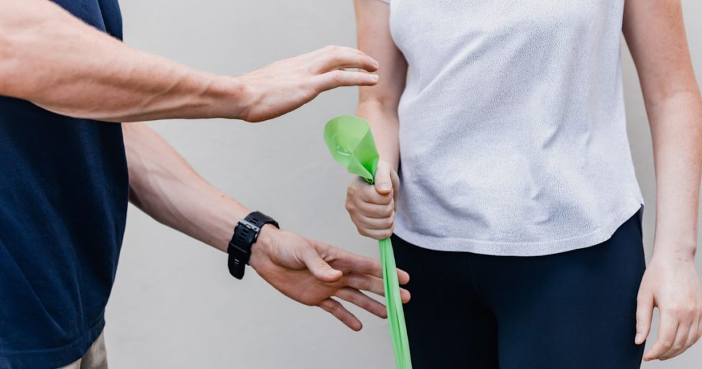 a person holding a green object in their hand