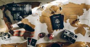 black DSLR camera near passport