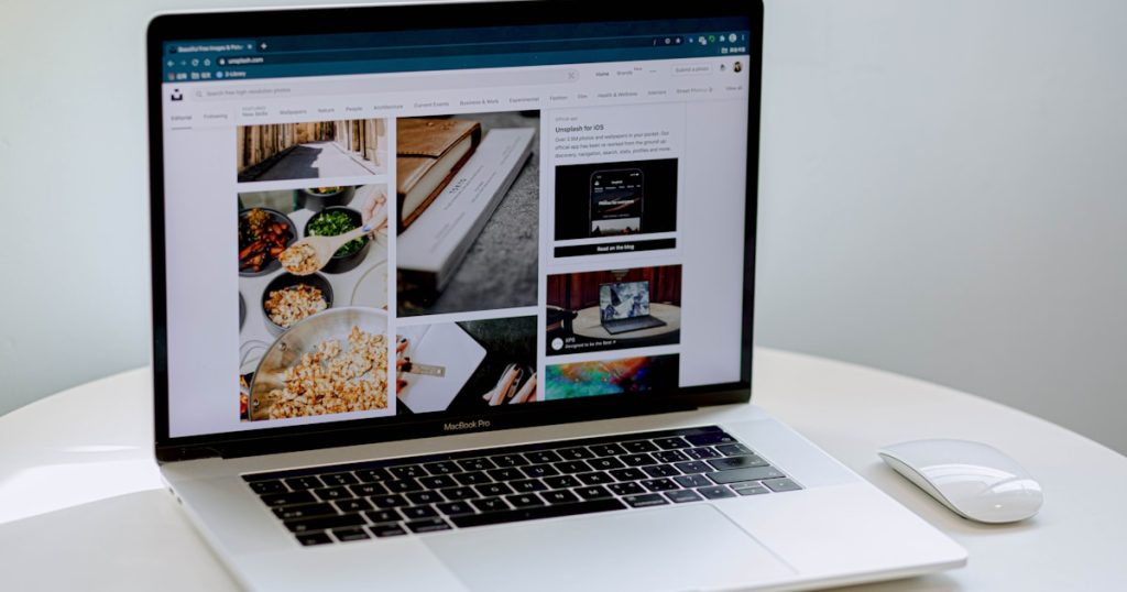 macbook pro on white table