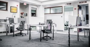 black metal chairs and table near white wall