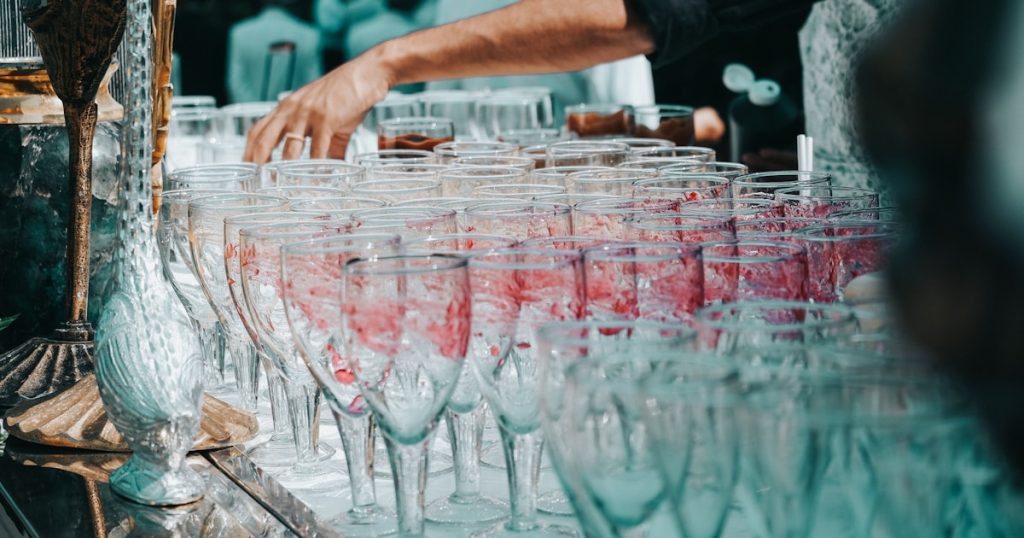 a table filled with lots of wine glasses