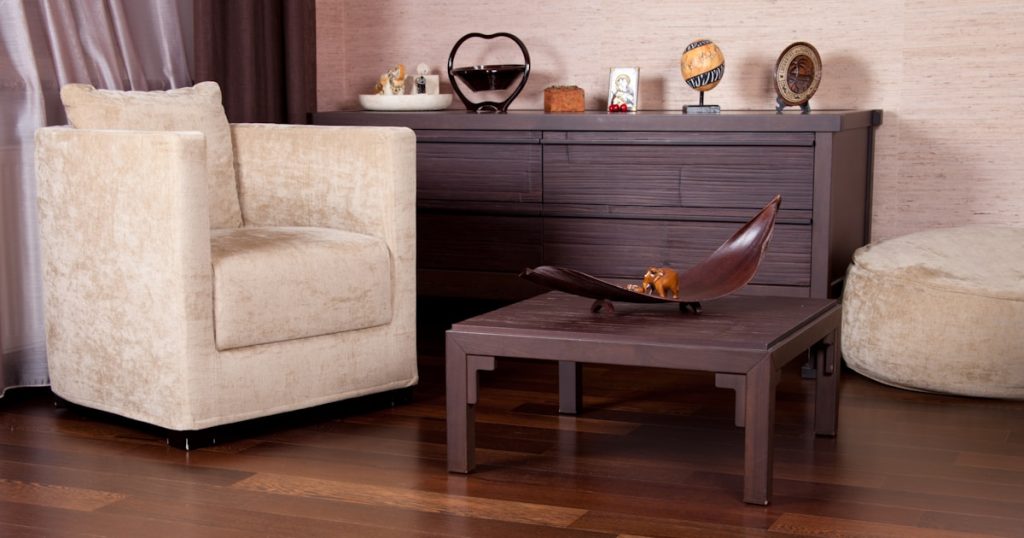 A living room filled with furniture and a wooden floor
