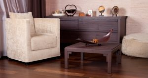 A living room filled with furniture and a wooden floor