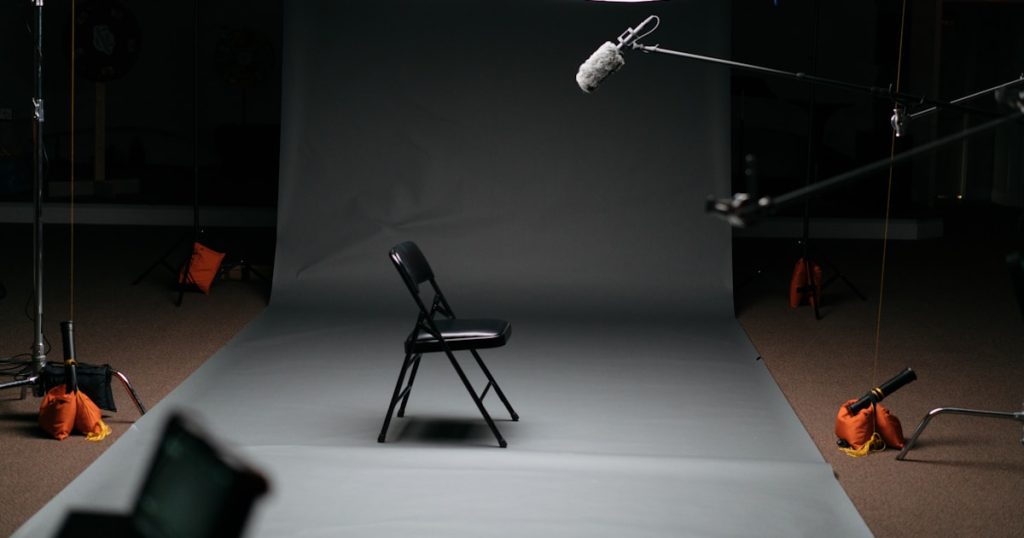 black folding chair on canvas