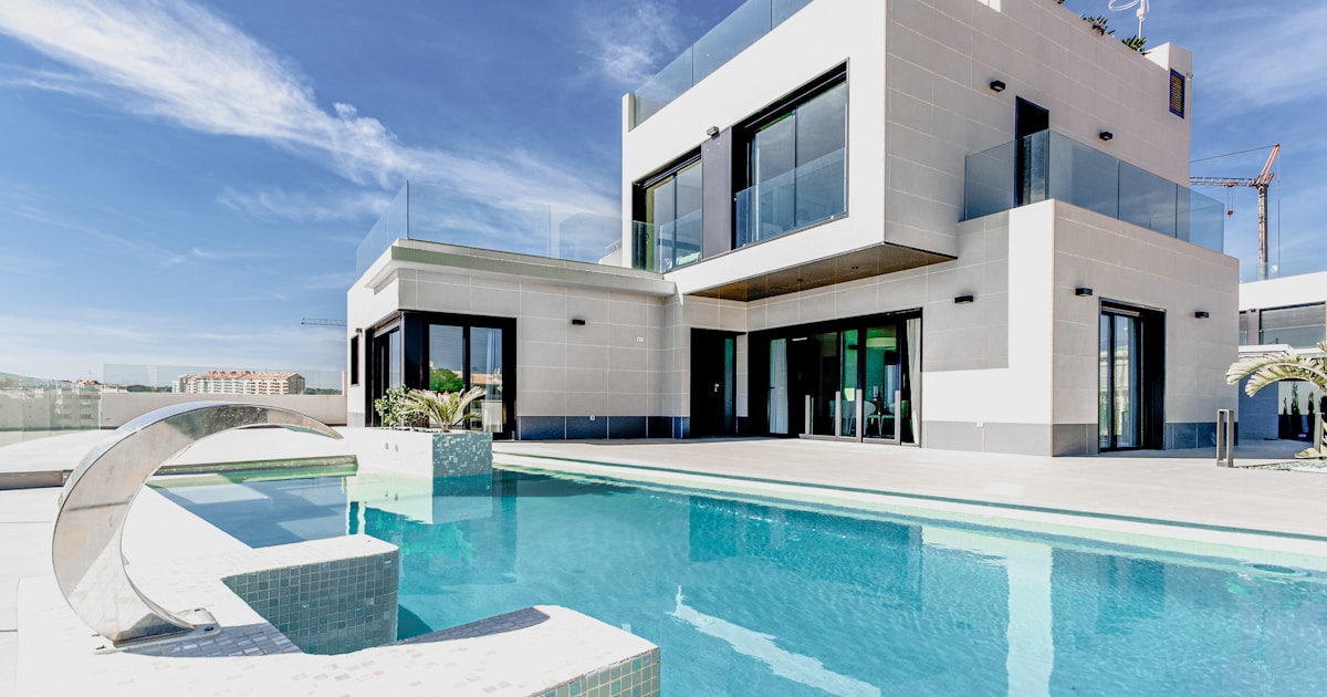 white concrete building under blue sky during daytime