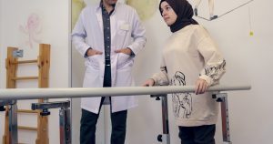 a man and a woman standing next to each other
