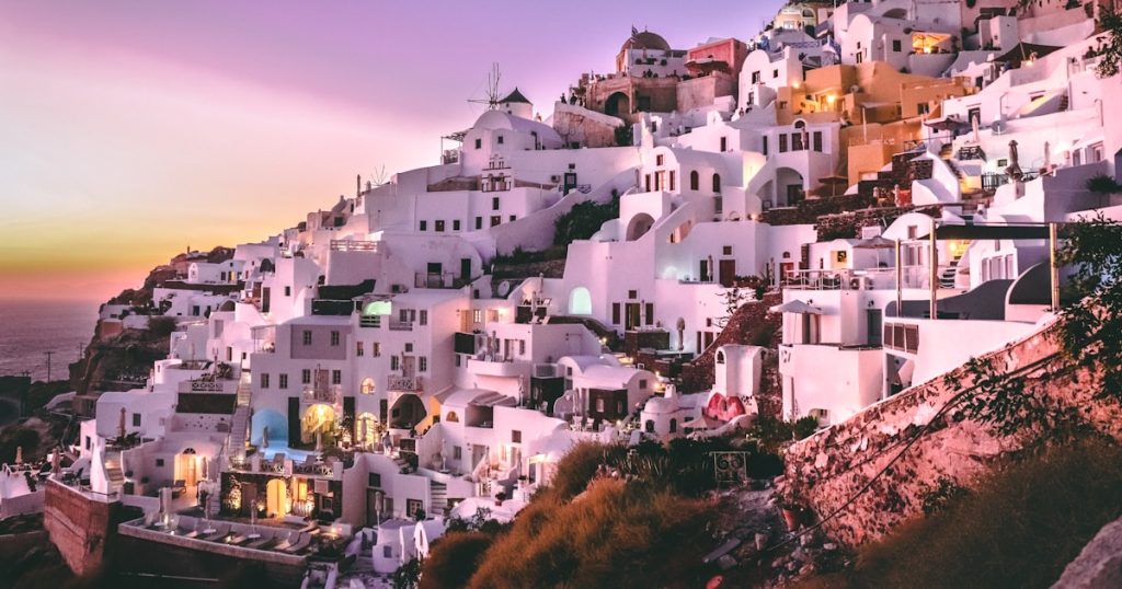 white concrete houses on hill during daytime