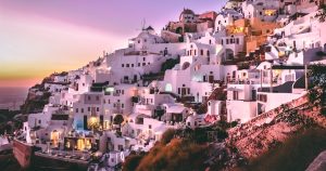 white concrete houses on hill during daytime