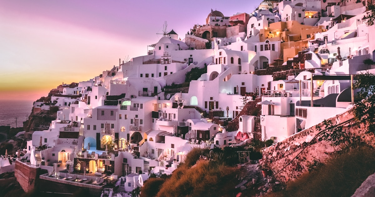 white concrete houses on hill during daytime