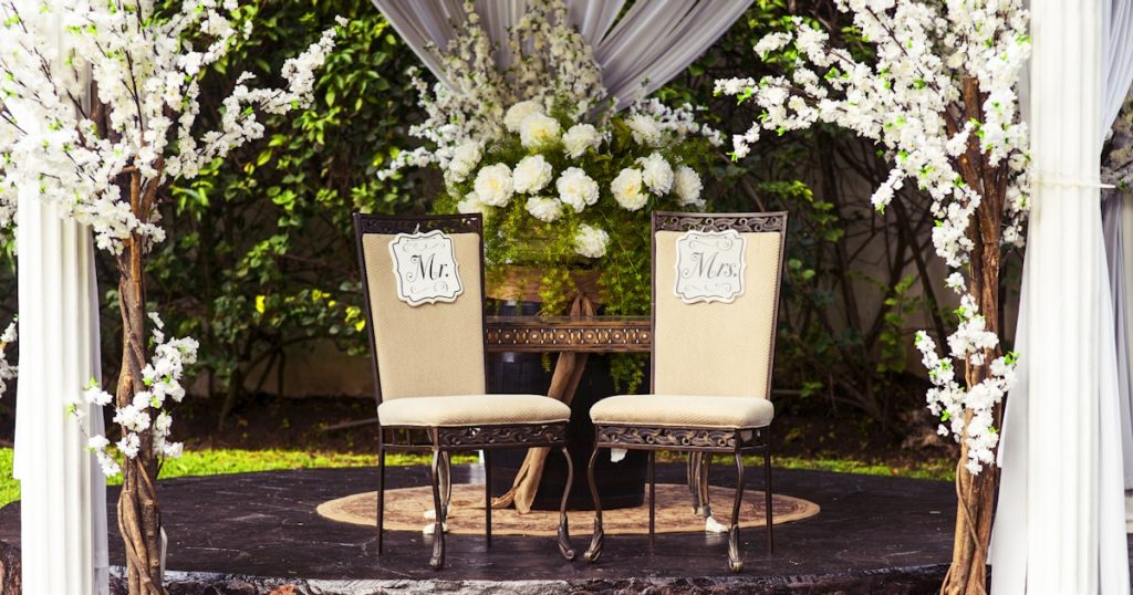 two black steel chairs beside table