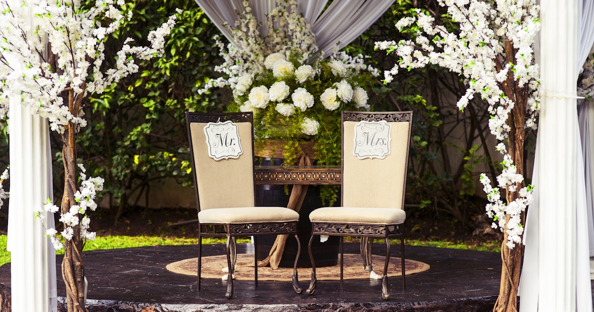 two black steel chairs beside table