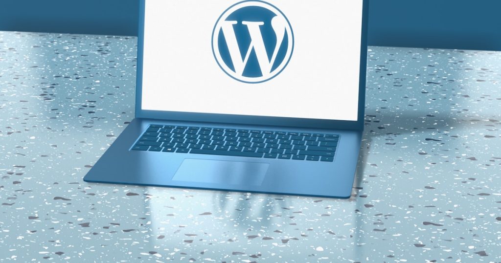a laptop computer sitting on top of a table