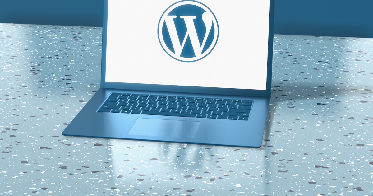 a laptop computer sitting on top of a table